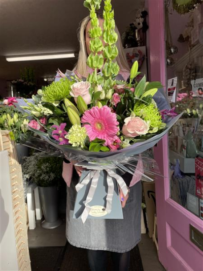 Big Belter Handtie - When you need to get a WOW that’s a belter, then this is the one, A luxury handtie of flowers chosen by lesley and finished off in luxury wrapping any specific flowers wanted please leave a comment in the box